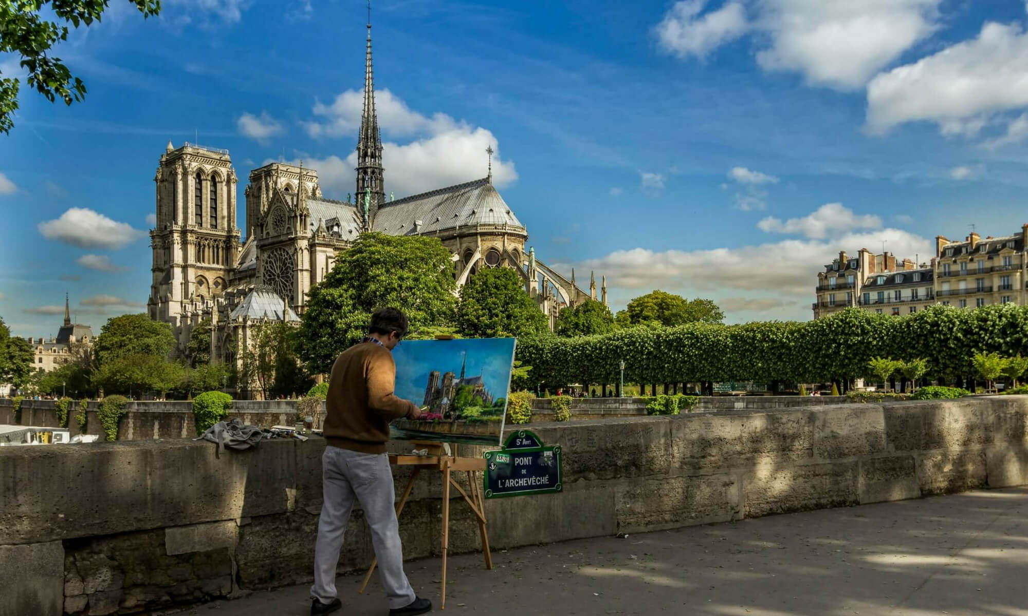 Artist painting Notre Dame