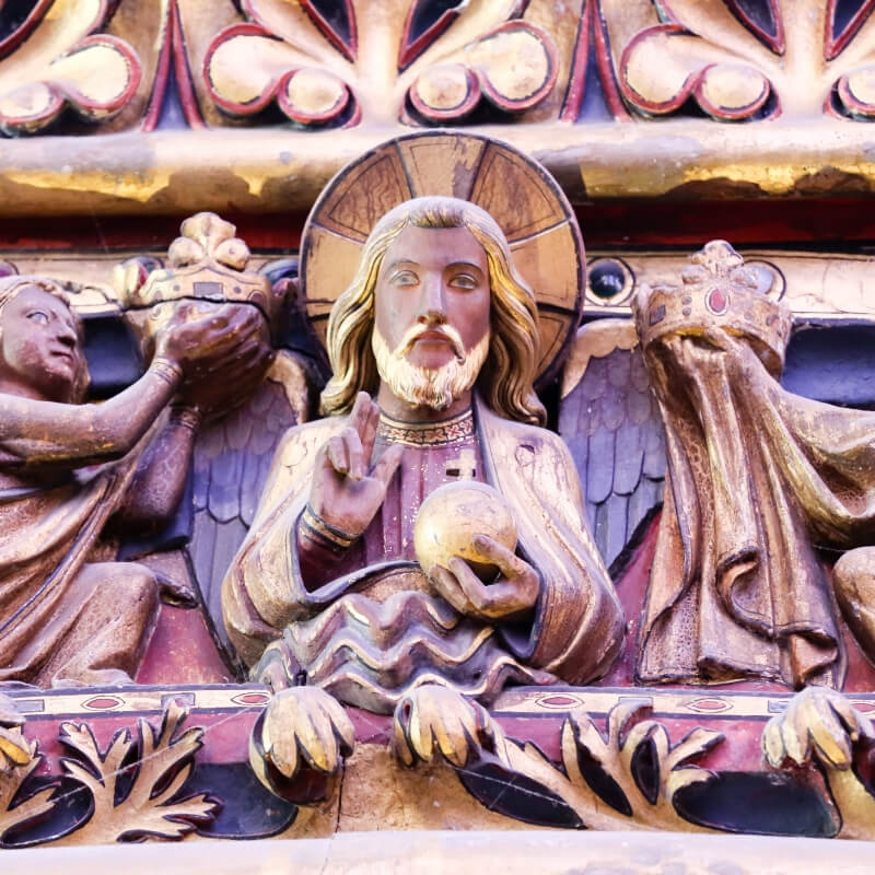 A detail in the wood carving at the Sainte Chapelle which shows a Saint and his halo.