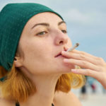 Woman smoking a cigarette without a care in the world