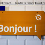 Sign that reads "Bonjour !" that greets people as they exit their flight into France at the Paris airport