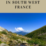 serene landscape in the ariège with a small lake and mountains