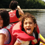 Matt's daughter having fun in a canoe with their mother at the helm: loire valley and dordogne episode