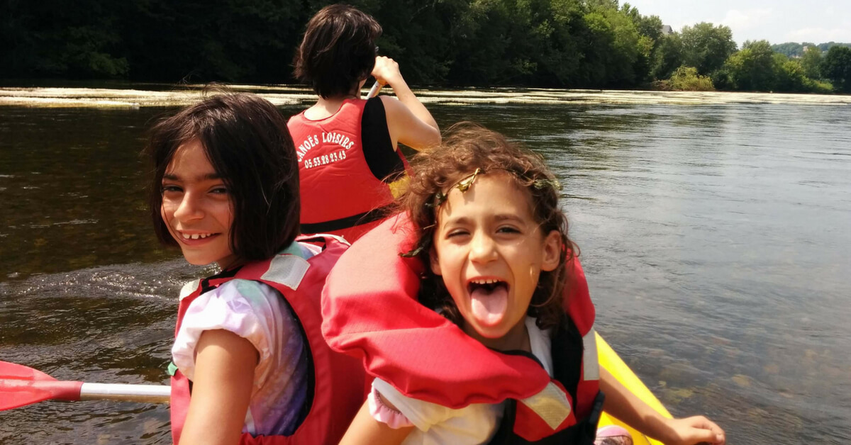Matt's daughter having fun in a canoe with their mother at the helm: loire valley and dordogne episode