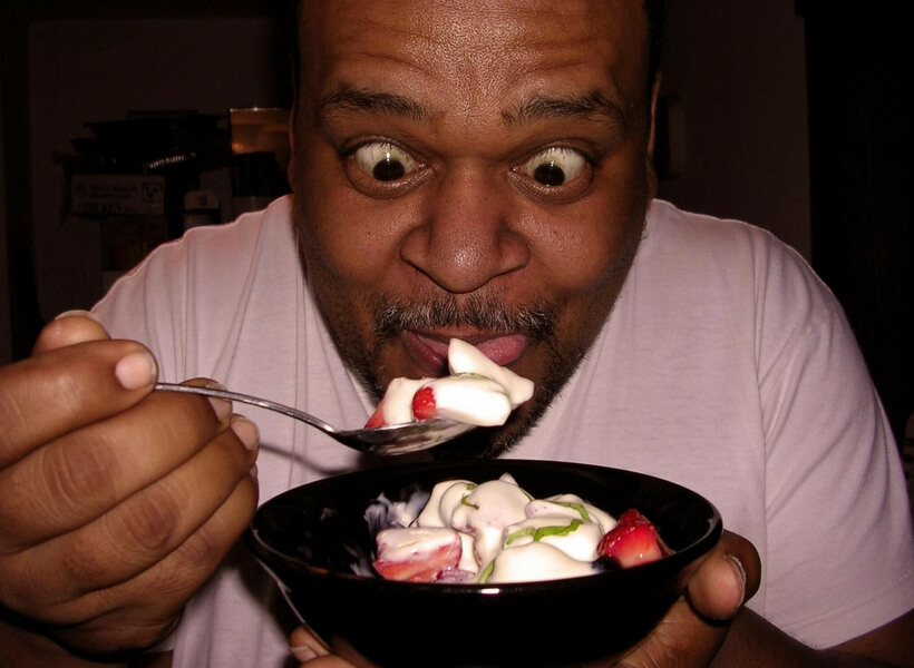 Man eating his ice cream too eagerly; table manners in france