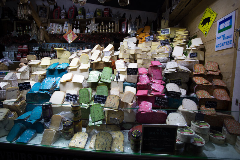 colorful cheeses at the Paris Christmas Market