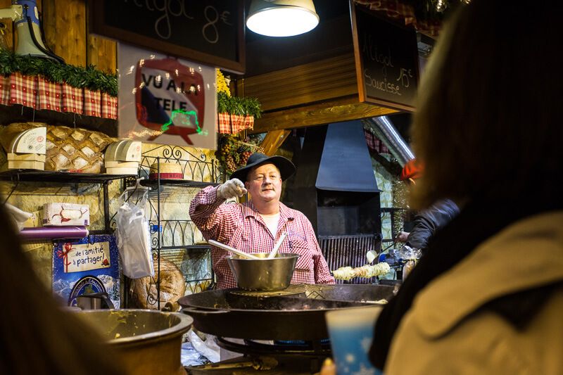 aligot vendor at the Paris Christmas Market