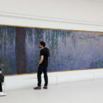 Visitors at the Orangerie Museum in Paris, overview of one of the museum rooms