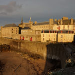 city of Saint-Malo at dusk showing the rampart walls mentioned in the book all the light we cannot see