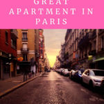 Paris street at sunset with cars parked on the right side of the street