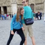France with Teenagers: Henry and his sister in front of Notre Dame in Paris