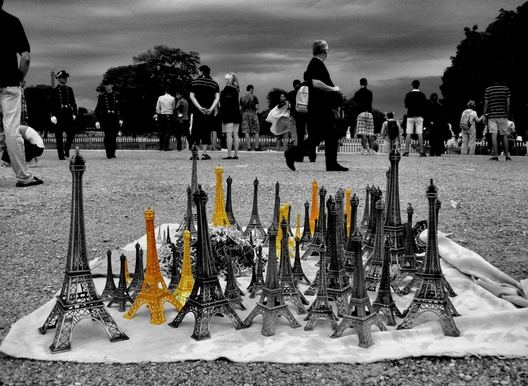 street vendor of eiffel tower trinkets in Paris