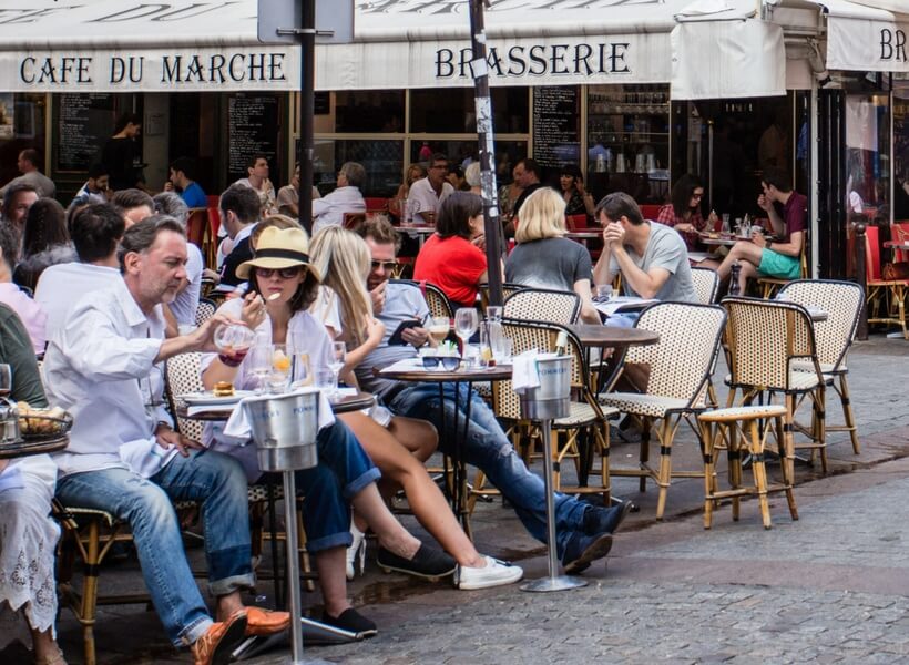 People at a cafe in Paris; first time in Paris