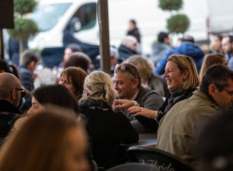 people chatting at a café in Toulouse; the ultimate guide to toulouse