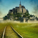 mont saint michel with imagined train tracks going all the way to the mont