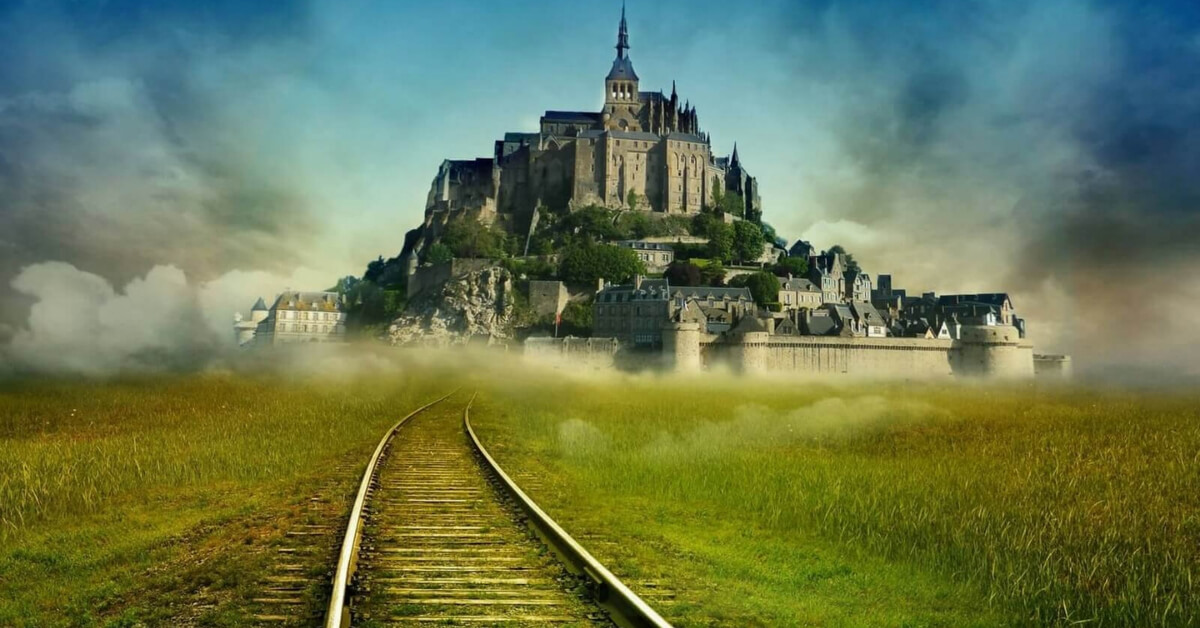 mont saint michel with imagined train tracks going all the way to the mont