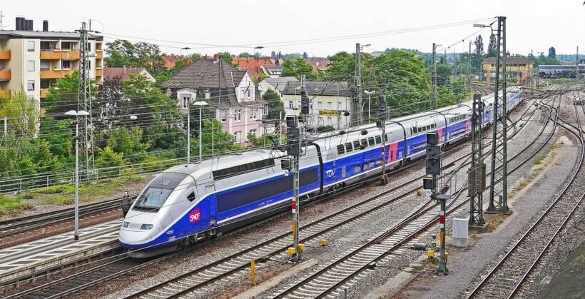 TGV train riding in a city; trains in france