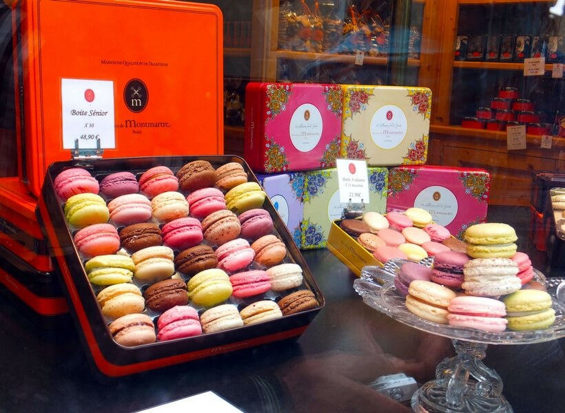 boxes of macarons in a store window