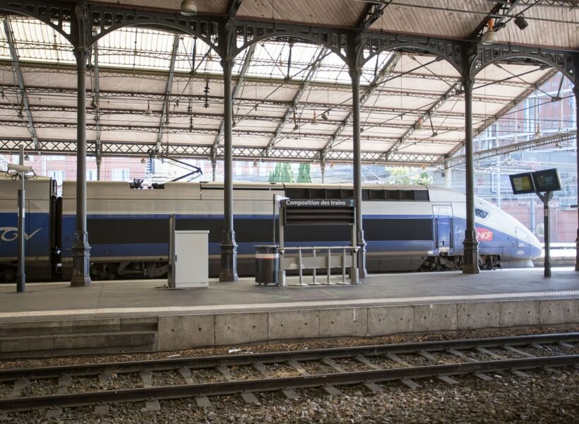 TGV train loading passengers at a train station in Toulouse