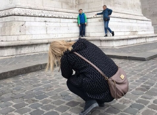 Erin taking a picture of her children in Paris