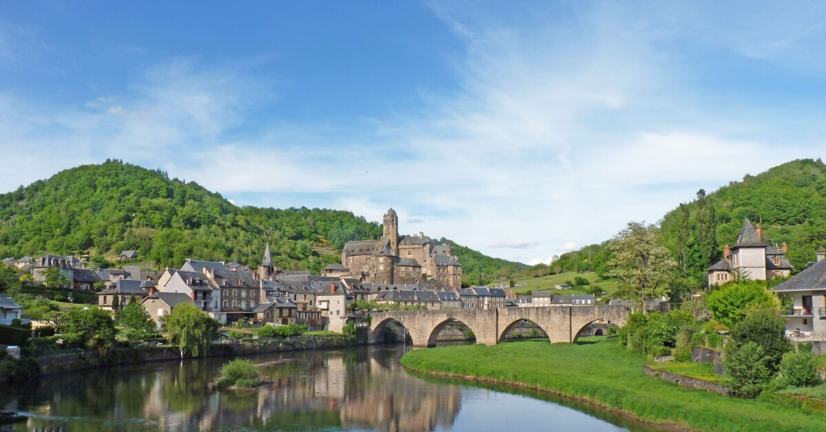 the city of Estaing in the Aveyron: river and medieval bridge