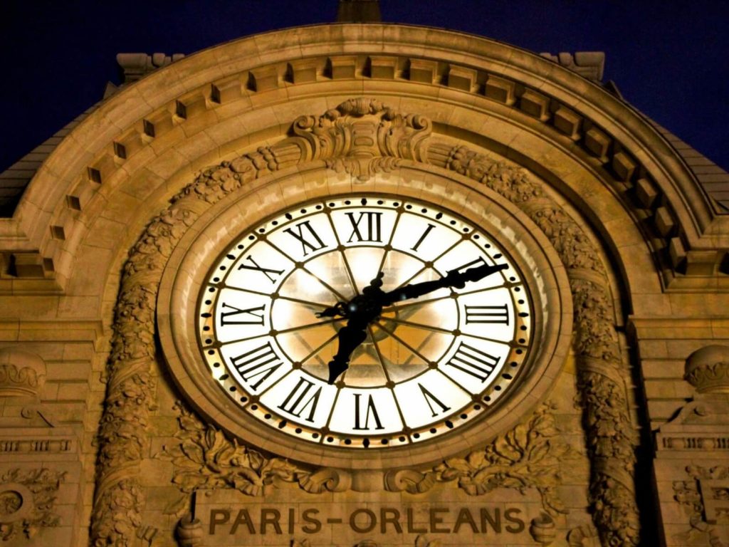 the orsay museum clock seen from the outside of the museum