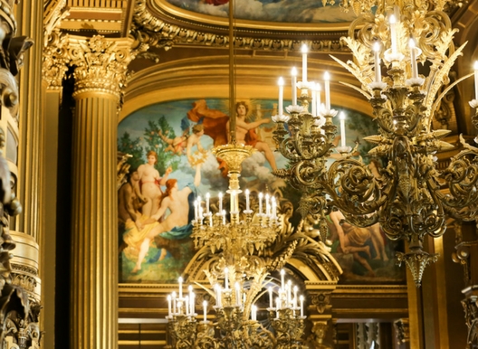 amazing chandelier at the Opera Garnier in Paris surrounded by guilded walls and art