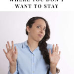 woman with both hands up at the level of her shoulders indicating the she's not happy
