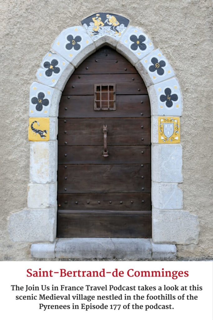 scenic wooden door in saint bertrand de comminges in occitanie, france