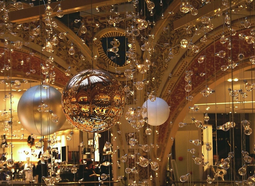 gold colored christmas decorations in a store