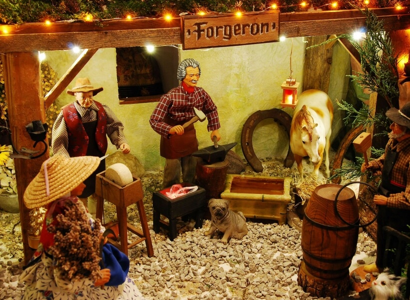 santons representing an old forge, a dog, a horse, and two other workers