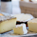 Cheese plate and wine bottle