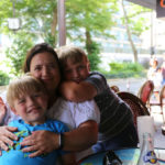 Jeanne, Luke and Max at a Paris café: Paris with Boys 7 and 10