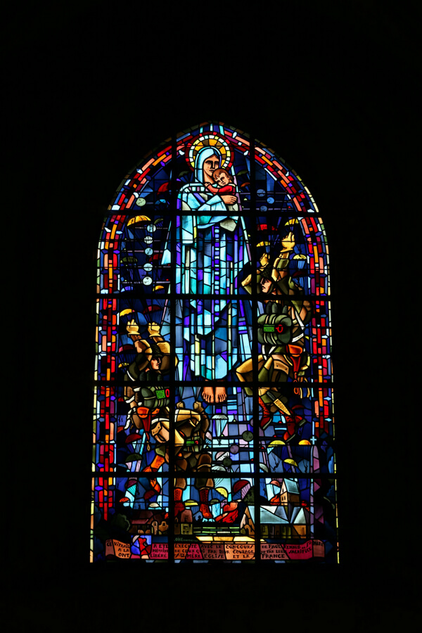 stained-glass window that depicts a paratrooper on D-Day