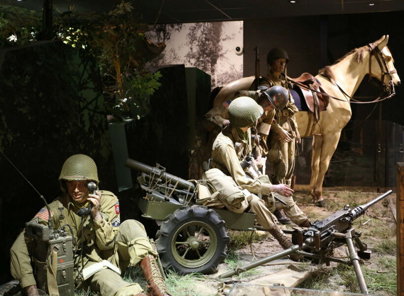 Museum display that shows men, guns and a horse in action during Operation Overlord