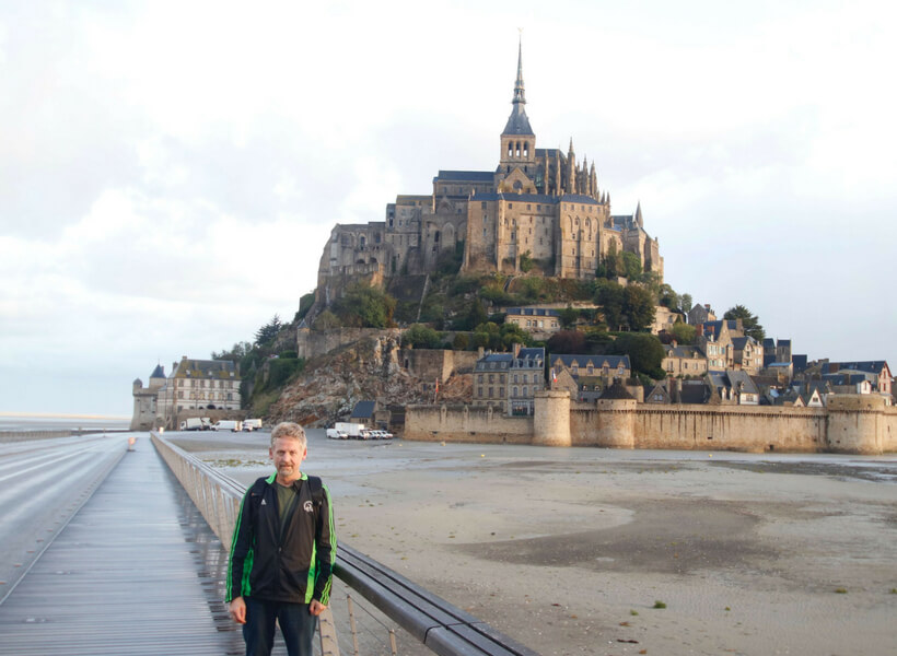 Phil who tells us about Operation Overlord is pictured in front of the Mont Saint Michel