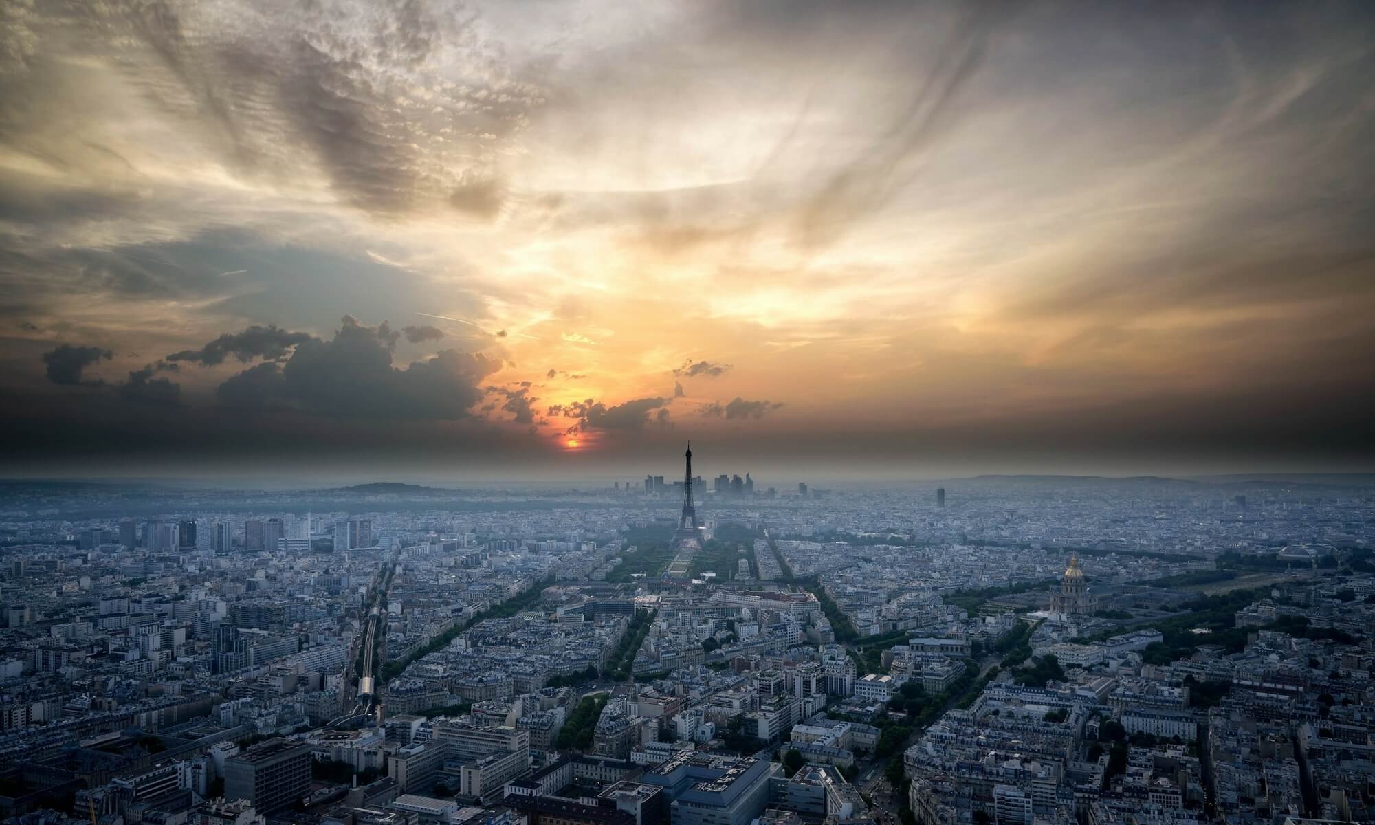 Paris skyline with eiffel tower and dramatic sky