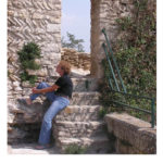 Mary-Lou sitting on stone stairs in the Vaucluse