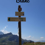 trail direction signs along the tour du mont blanc