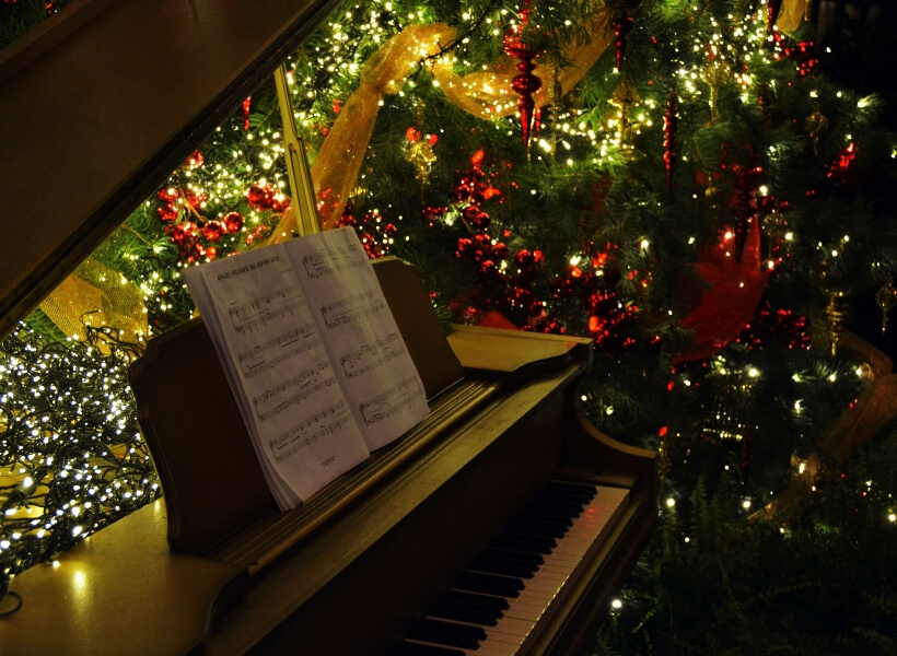 piano keyboard and Christmas tree in the background: French Christmas Songs Transcript Episode