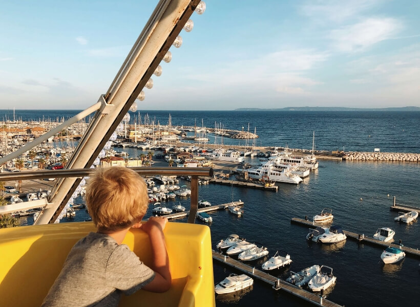 boy looking at a harbor in the Mediterranean: Great Destinations in France for Families Episode