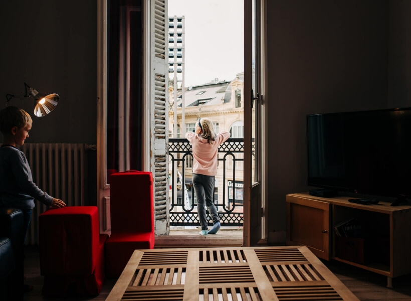 girl looking out of a window: vacation photos