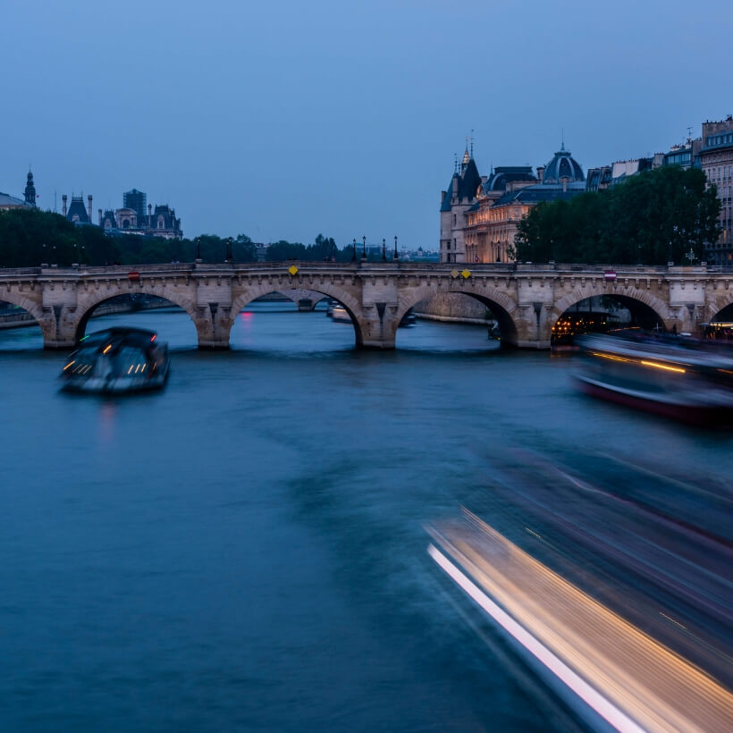 Seine River at sunset with light streaks from boats. 4 days in Paris episode.
