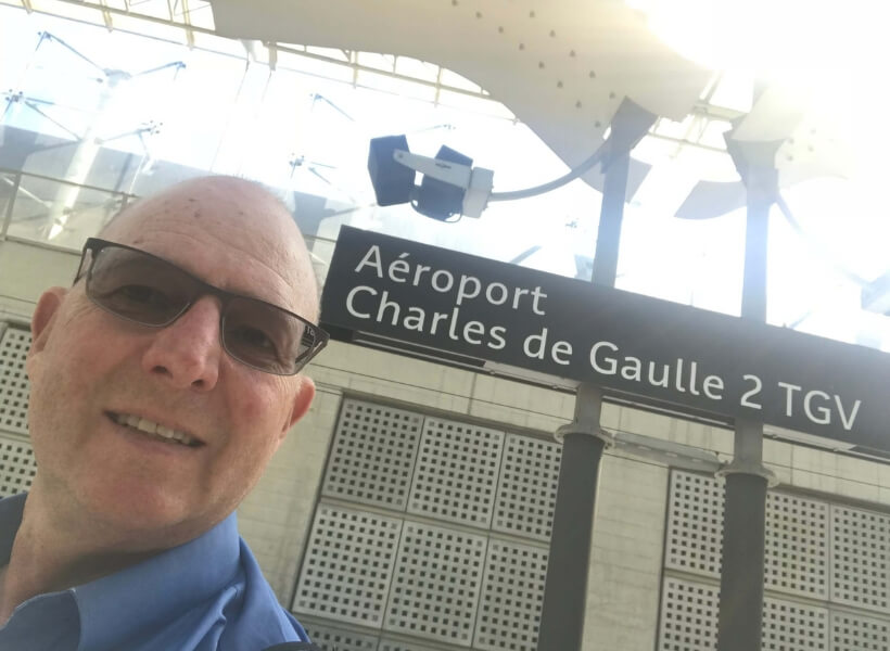 My guest Lachlan Cooke at the TGV station at Charles de Gaulle Airport: public transportation in france episode