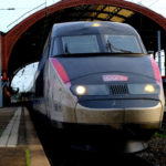TGV train leaving a train station: public transportation in france episode