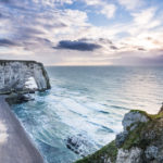 cliff of Etretat in Normandy with dramatic sea and sky