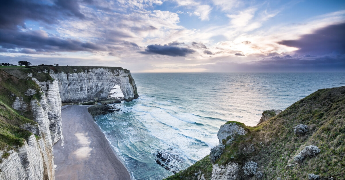 cliff of Etretat in Normandy with dramatic sea and sky