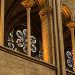 Stained-glass windows and stone columns inside Notre Dame before the fire of April 15, 2019