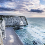 cliff of Etretat in Normandy with dramatic sea and sky