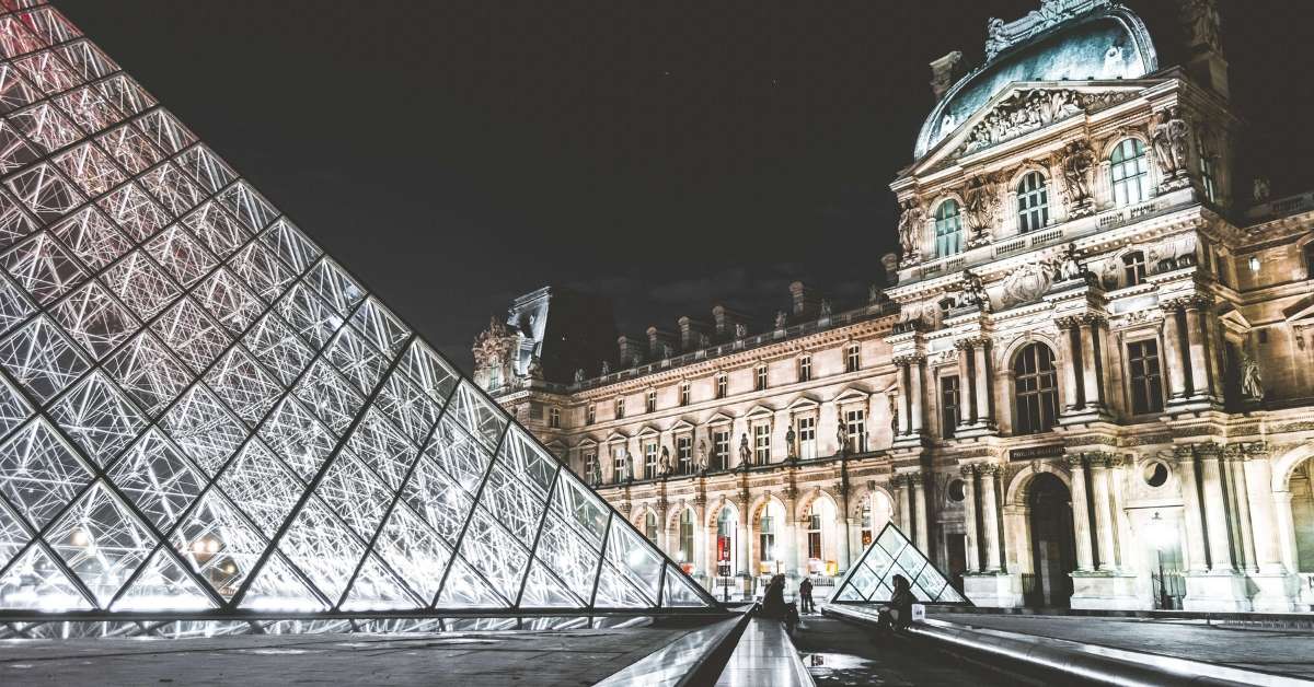 Outside of the Louvre at night: Visiting Paris with Teenagers Episode