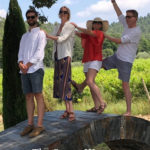 Tracey's family being silly in front of a scenic landscape: smart way to visit Provence episode